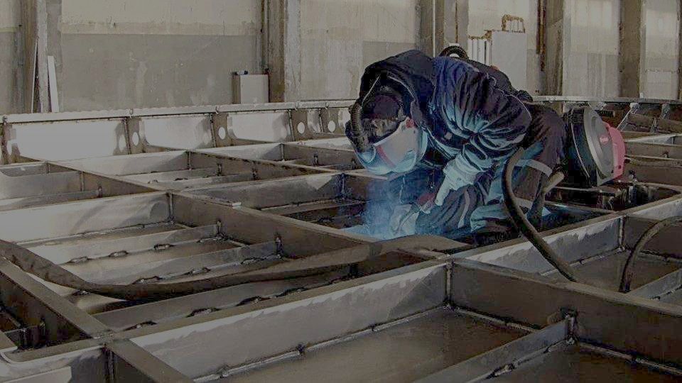 Qualified welder at work on an aluminium structure